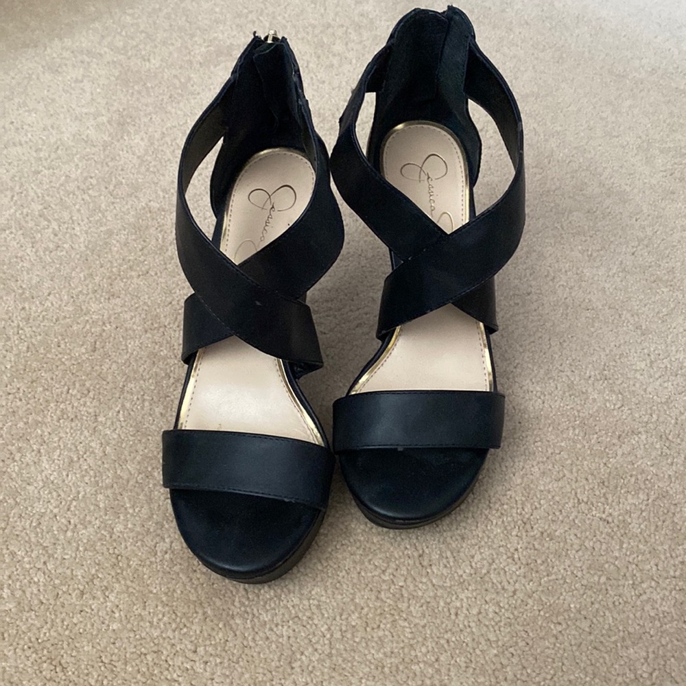 Jessica Simpson platform sandals with cross-cross detail over foot.